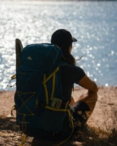 Photo by Toth Photos: https://www.pexels.com/photo/a-person-sitting-with-backpack-13622365/