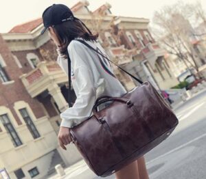 a young lady carried dark brown fossil travel bag 
