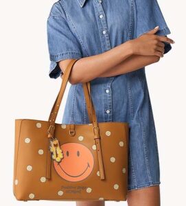 a young lady in blue dress holding smile fossil bag